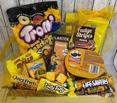 a yellow box filled with candy and snacks