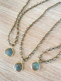 Denim crystal with a sparkly sheen paired with a lovely drop of faceted labradorite set in vermeil. Labradorite Necklace is 17.5” long with button and loop toggle closure. You can add a touch of elegance and sparkle to any outfit with the Denim crystal and faceted labradorite necklace. Gold Beaded Necklace With Labradorite Stones, Gold Labradorite Crystal Necklace With Gemstone Beads, Gold Crystal Necklaces With Gemstone Beads, Gold Labradorite Gemstone Beaded Necklace, Handmade Gold Labradorite Beaded Necklaces, Gold Teardrop Labradorite Necklace, Gold Bohemian Briolette Crystal Necklace, Adjustable Teardrop Gemstone Beaded Necklaces, Stone Bead Jewelry