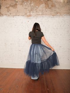 Our Yvonne Tulle Skirt is the ultimate statement piece for layering! With its high-rise elastic waistband and sheer, layered tulle, this midi skirt adds a dreamy touch to any outfit. Pair it with a fitted top and heels for a standout evening look, or wear it over jeans for an edgy daytime vibe. Details High Rise Pull-On Style Elastic Waistband Sheer Layered Tulle Midi Length Size recs: 0-4 Small, 4-6 Medium, 8-10 Large Provides lots of stretch Sheer Tulle Skirt, Layered Tulle Skirt Midi, Chic Tulle Mesh Skirt, Blue Tulle Party Maxi Skirt, Sheer Tulle Tiered Skirt, Sheer Skirt Outfit, Chic Non-stretch Tulle Skirt, Quilted Outerwear, Skirt Co Ord