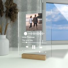 a clear acrylic plaque with an image of two people holding hands and the words love forever you and me