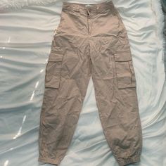 Abercrombie Pants Size Xs Tan Pockets On The Side (Cargo Style Pants) New With Tags Synched By The Ankle High Waisted Beige High Waist Parachute Pants With Side Pockets, High-waist Beige Parachute Pants With Side Pockets, Fitted Beige Pants With Side Pockets, Beige Utility Full-length Bottoms, High Waist Beige Pants With Pockets, Fitted Beige Pants With Pockets, Beige Parachute Pants For Spring, Beige Cargo Bottoms With Long Pants, Fitted Beige Bottoms With Cargo Pockets