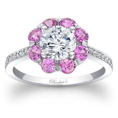 a pink and white diamond ring on a white background