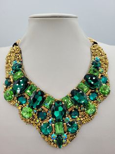 Party Crystal Emerald Necklace, Party Emerald Crystal Necklace, Green Crystal Necklace With Stones, Green Costume Jewelry Necklace, Green Crystal Necklace With Jewels, Unique Party Necklace With 17 Jewels, Luxury Handmade Necklace For Party, Green Crystal Necklace For Celebration, Unique Green Necklaces For Celebration