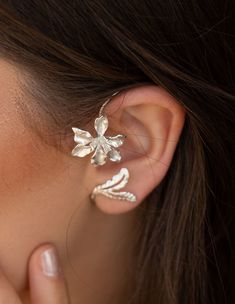 A beautiful handmade 925 sterling silver Earring These Orchid Floral Ear Cuff, earrings is made of excellent quality materials and is fully hypoallergenic & nickel free. It is also tarnish resistant. Ear cuffs are the coolest accessory at the moment! Cuff earrings embrace and flatter your ears, they make them look even more dainty and give you that feminine vibe you want. A simple pair of earrings that can be worn every day. Price is for Single Please see all photos and select the color you Unique Silver Wrap Earrings, Dainty Silver Ear Cuff For Wedding, Sterling Silver Ear Cuff With Ear Wire For Weddings, Silver Ear Climbers For Wedding, Handmade Elegant Ear Climbers, Unique Silver Ear Cuff For Wedding, Elegant Silver Ear Climbers, Handmade Sterling Silver Ear Climbers, Unique Sterling Silver Ear Cuff For Weddings