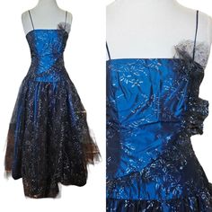 Vintage 80s Size 8 Formal Prom Gown Dress Dark Blue Black Tulle Strapless  No brand tag Cardboard tag  Vibtage size 12 Modern size 8 Midnight blue Light blue and silver floral glitter Black Tulle full skirt (2 layers) Rear hidden zipper Tulle accent across front Spaghetti strap Floor length Irredescent taffeta material that has purple hue Clean and flaw free Approximate measurements laid flat  Chest 16.5" Waist 14" Hips 19" Length 55.5" Dress Dark Blue, Black Tulle, Gown Dress, Purple Hues, Flat Chest, Prom Gown, Full Skirt, Dress Clothes For Women, Midnight Blue