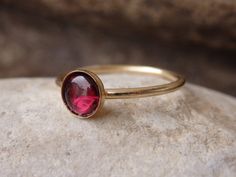 Garnet Gold Ring, Red Gemstone Stacking Ring, Dark Red Minimalist Ring, January Birthstone, Gold Filled Ring, Garnet jewelry, Red Stone Ring This red garnet gold stacking ring will be a perfect gift for women. It is made of 14k gold filled and garnet stone. Measurements: Size- all The center stone is 6 mm The ring will be packed in a gift box. FOR MY RINGS COLLECTION HERE: https://www.etsy.com/il-en/shop/rebekajewelry?section_id=14282915&ref=shopsection_leftnav_9 TO GET TO MY SHOP: https://w Red Birthstone Stackable Rings Fine Jewelry, Fine Jewelry Red Birthstone Stackable Rings, Red Gemstone Stackable Rings Fine Jewelry, Red Gemstone Stackable Rings In Fine Jewelry, Fine Jewelry Red Gemstone Stackable Rings, Fine Jewelry Stackable Red Birthstone Ring, Red Stackable Birthstone Ring In Fine Jewelry Style, Red Stackable Birthstone Ring, Dainty Red Solitaire Ruby Ring