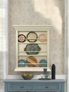 an old china cabinet with plates and bowls on it