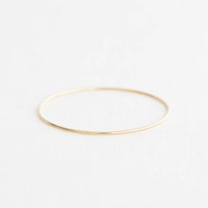 The Original – Yearly Co. Gold Stackable Cuff Bracelet For Everyday, Adjustable Yellow Gold Bangle For Anniversary, Dainty Stackable Gold Cuff Bracelet, Elegant Everyday Bracelets With Round Band, Dainty Gold Stackable Cuff Bracelet, Gold Jewelry With Smooth Bezel As Gift, Classic Round Band Bracelet For Anniversary, Everyday Timeless Stackable Bangle, Elegant Everyday Round Band Bracelets