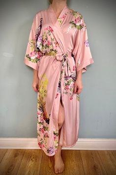 Luxury Kimono satin gown with beautiful painted flowers, decorating this very feminine Robe.  This gown is luxury satin, a beautiful soft elegant sensual fabric, which drapes beautifully over the body.  This robe is ankle length, with belt, 3/4 arms.  These Gowns are Free Size, fits UK 8 to 16 High Quality Satin machine washable on cool Kimono, inspired handmade, vintage / Boho style dressing gown, kimono robe.  Please note, model is 5ft 5 and the gown come to the ankle. Length from nape of neck to bottom hem: approx 123cm This robe is part of our luxurious collection, they make a beautiful gift for the ones you love, and will make them Feel truly special. 4 Arms, Pink Kimono, Gown Vintage, Satin Kimono, Vintage Boho Fashion, Style Japonais, Boho Kimono, Bridesmaid Robes, Satin Gown