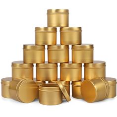 a large stack of gold colored jars with lids on each one is stacked in the shape of a pyramid