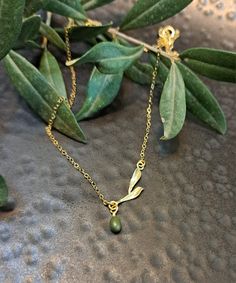 "Olive Necklaces on  branch  with olive leaves .sterling silver . or Gold  vermeil or rose gold vermeil  , Minimal dainty Necklaces, Gift for graduation, Mother's day gift, Gift for sister ♥ Shown at size 17 \" ♥ You can choose the size 14 \"-20\" ♥ High Quality Designer Jewelry ♥ Comes in a cute little package ready for gifting. ♥ Comes with a card. As in photo or you can Send your text .And we will prepare the card ♥ We can stamp the leaf with the letter you choose. Make the jewelry personal CURRENT PRODUCTION TIMES All items are made to order. Usually between 1-3 business days. If you need it sooner, please send us a message on Etsy :) PEXPEDITED SHIPPING You can choose a faster shipping option by buying the Expedited shipping listing here: https://www.etsy.com/listing/265766138/expedit Olive Tree Jewelry, Olive Leaf Necklace, Olive Necklace, Necklaces Gift, Gift For Graduation, Christmas Jewellery, Olive Leaves, Dainty Necklaces, Delicate Necklaces