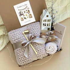 a gift box filled with towels and other items