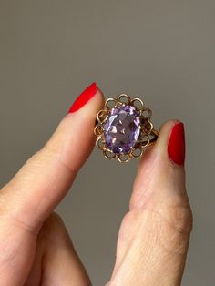 Vintage 1970s Floral Openwork Amethyst Ring ERA: 1970's STAMPS & HALLMARKS: '9.375' for 9ct Gold, Birmingham Assay, date mark 'V' for 1970 GEMSTONES: Amethyst RING SIZE: UK O 1/2, US 7 3/4,  EU 55 3/4 WEIGHT: 4.8 grams    APPROX MEASUREMENTS: Amethyst is 14mm x 10mm with 5mm depth (approx).  Roughly 3.71 carats.  Setting sits approx 7mm high on the finger. DESCRIPTION:  If you're looking for a statement amethyst ring, look no further!  Set in 9ct gold with stunning openwork floral style setting Vintage Purple Amethyst Ring For Anniversary, Formal Vintage Amethyst Ring, Vintage Yellow Gold Amethyst Ring, Vintage Amethyst Ring Jewelry, Vintage Purple Amethyst Ring For Wedding, Vintage Gold Amethyst Rings, Vintage Purple Amethyst Ring Stamped 14k, Vintage Yellow Gold Amethyst Ring Gift, Vintage Yellow Gold Amethyst Ring For Anniversary