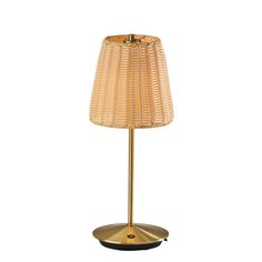 a table lamp with a gold base and a light shade on it's side