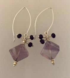 Square Amethysts hang from sterling silver long ear wires.  Accented by small amethyst rondelle drops. Sterling Silber, Ear Wires, Jewelry Earrings Dangle, Etsy Earrings, Dangle Drop Earrings, Dangle Earrings, Amethyst, Jewelry Earrings, Drop Earrings