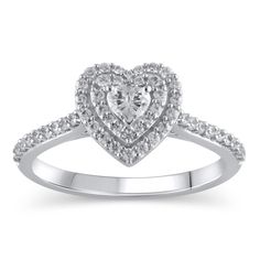 Steal her heart with the romantic details of this charming diamond engagement ring. Crafted in cool 10K white gold, this look showcases a 1/6 ct. heart-shaped diamond sparkling in a double diamond-lined frame. The shank shimmers with diamonds while hidden bezel-set diamonds adorn the gallery. Captivating with 1/2 ct. t.w. of diamonds and a bright polished shine, this engagement ring suits her sweet style. White Diamond Ring With Halo Setting For Valentine's Day, White Heart Ring With Diamond Accents, Heart Cut Diamond Ring With Halo Design, White Heart-shaped Diamond Ring, White Heart Ring With Halo Setting, Diamond Heart Ring With Halo Design, Dazzling Heart-shaped White Gold Diamond Ring, White Diamond Heart Ring With Halo Setting, Engagement Rings Zales