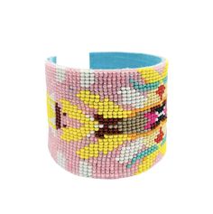 Inspired by the color schemes of our vibrant patterns, this beaded cuff bracelet was designed to bring a pop of color to any outfit! Designed by Laura Park. Dimensions: 2" wide Colors inspired by our exclusive pattern "Park Avenue" Made in India Laura Park, Green Wrap, Pink Wrap, Park Designs, Vibrant Patterns, Beaded Cuff Bracelet, Beaded Cuff, Pretty Bracelets, Flower Accessories