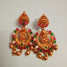 Adorn yourself with the enchanting allure of traditional South Asian elegance with our exquisite collection of Jhumka earrings. Elevate your look with these beautiful Jhumka earrings, meticulously crafted to infuse sophistication and grace into every ensemble. Designed to captivate, these earrings are a celebration of Indian and Pakistani jewelry traditions, blending intricate detailing with modern flair. Whether you're attending a lavish party or a festive celebration, these statement Jhumkas a Temple Jewelry Earrings With Pallu For Celebration, Temple Jewelry Style Jhumkas For Navratri, Temple Jewelry Jhumkas For Navratri, Temple Jewelry Earrings For Diwali Celebration, Temple Style Drop Jhumkas For Navratri, Temple Style Jhumkas For Navratri, Temple Jewelry Chandbali Jhumkas For Navratri, Temple Jewelry Danglers For Diwali Celebration, Diwali Temple Jewelry Danglers For Celebration