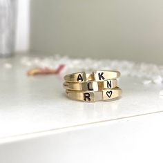 Our Personalized Open Cuff Ring might be small but it makes a mighty statement. This gorgeous minimalist style ring is perfect for stacking two, three, even four or layering with other ring styles. The fact that you can personalize it with initials and other designs just make it even better or leave it blank, it's totally up to you. Besides initials, this piece can be personalized with numbers, hearts, stars,s or flower symbols. This ring is hand-made and stamped in our studio at the time of order, of heavy 10 gauge 14kt gold filled metal wire. It's about 2mm thick and has an organic shape that is created by working the metal. This ring is 100% 14kt gold-filled, it is very durable and will wear very well with appropriate care, it will not change color or discolor your skin. I promise you'r Gold Stackable Rings With Initials For Everyday, Everyday Gold Stackable Rings With Initials, Personalized Adjustable Open Midi Rings, Adjustable Initials Stackable Rings For Everyday, Adjustable Stackable Initial Ring For Everyday, Everyday Open Ring With Initials, Everyday Adjustable Stackable Rings With Initials, Dainty Stackable Initial Open Ring, Dainty Initial Open Ring Stackable