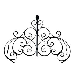 a black and white photo of a wrought iron fence with an ornate design on the top