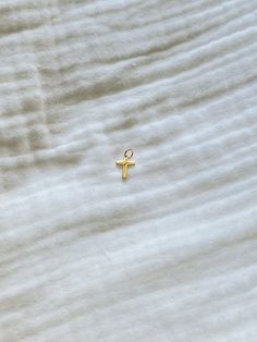 Introducing our newest addition: the Cross Charm! Made with gold-filled material, this charm adds a touch of elegance to any accessory. Perfect for showing off your faith (and fashion sense), the Cross Charm is a must-have for any jewelry collection. 14k Gold Filled Gold Charms For Everyday, Everyday 14k Gold Filled Gold Charms, Everyday 14k Gold-filled Gold Charms, Yellow Gold Charm Necklaces With Cross Pendant, Gold 14k Cross Pendant Charm Necklace, Dainty Gold Hypoallergenic Charms, 14k Gold Cross Pendant Charm Necklace, Dainty Hypoallergenic Gold Charms, Gold Cross Charm Necklaces