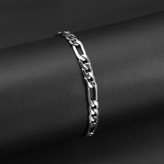 The Stainless Steel Figaro Chain Bracelet is the epitome of a versatile rugged or classic accent piece. Designed with a sleek polished finish, this bracelet is also great for special occasions. Available in widths from 3mm to 12mm you up your style with a variety of looks from the accent of the 3mm to a bolder look wit Bf Clothes, Silver Bracelet Designs, Mens Cuff Bracelets, Mens Cuff, Silver Chain For Men, Biker Jewelry, Silver Bracelets For Women, Mens Bracelet Silver, Jewelry Accessories Ideas