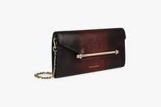 Understated and elegant, our best-selling multrees chain wallet is the perfect day-to-evening companion. Handcrafted in spain, this versatile purse can also be carried as a timeless clutch or transformed into a crossbody bag with its removable gold chain strap. The magnetic closure, decorated with our signature strathberry music bar, keeps your essentials secure and opens to reveal a surprisingly spacious interior - featuring 8 card slots and a zipped pocket with a leather pull. Taking inspiration from the enchanting lights of fall evenings, our new lizard embossed degrade leather graces some of our much-loved styles. The leather is meticulously crafted at an italian tannery, applied using a unique, singular technique to create a seamless gradient effect in captivating burgundy hues. Music Bar, Chain Wallet, Travel Wallets, Wallet Chain, Leather Pulls, Leather Mini, Magnetic Closure, Handbag Accessories, Embossed Leather