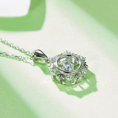 An eye-catching round moissanite dances with ease at the center of this appealing women's necklace, expressing your unstoppable love. Additional round gem set in sterling silver frame the center. Features Moissanite was originally found in meteorites(Chemical name: Silicon Carbide). It was first discovered in 1893, while a scientist was examining meteor samples from a crater in Arizona. After many years, the experts has been recreated moissanite in the laboratory, that make the gemstone with fri Silver Round Diamond Necklace With Halo, Diamond White Solitaire Necklace With Cubic Zirconia, Silver Diamond Solitaire Necklace With Round Pendant, Silver Solitaire Necklace With Oval Pendant For Anniversary, Round Moissanite Solitaire Necklace With Halo Setting, Wedding Necklace With Round Pendant And Center Stone, Silver Moissanite Round Diamond Necklace, Silver Round Diamond Necklace With Halo Setting, Silver Solitaire Flower Pendant Necklace For Anniversary