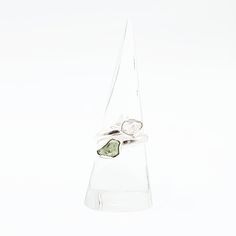 Divine Elegance Elevate your style with our exquisite Herkimer Diamond & Moldavite Ring, set in gleaming sterling silver. This stunning piece combines the celestial brilliance of Herkimer diamonds with the otherworldly energy of Moldavite, creating a ring that radiates elegance and power. Perfect for those who appreciate unique and spiritually significant jewelry, this ring is a true statement piece. Amplify Your Spiritual Journey Herkimer diamonds are renowned for their exceptional clarity and Moldavite Ring, Vibrational Energy, Worry Stones, Herkimer Diamond, Tumbled Stones, Ring Sterling Silver, Spiritual Journey, Spiritual Growth, Stone Settings