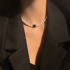 Handcrafted with care, this necklace features lustrous baroque pearls and vibrant emerald green gemstone, elegantly arranged to create a stunning contrast. The rich green hues of the emeralds complement the shimmering pearls, making this necklace a timeless and versatile accessory. Features: Handcrafted Elegant and versatile design Perfect for both casual and formal occasions Makes a thoughtful gift for someone special Specifications: Material: Emerald green zircon, cultured baroque pearls Lengt Green Pearl Chain Jewelry As A Gift, Green Pearl Necklace As A Gift, Green Pearl Necklace For Gifting, Elegant Green Pearl Drop Necklaces, Elegant Green Necklaces With Pearl Drop, Formal Green Pearl Necklaces, Green Pearl Drop Necklace For Gift, Green Pearl Drop Necklace Gift, Green Beaded Necklace With Pearl Pendant