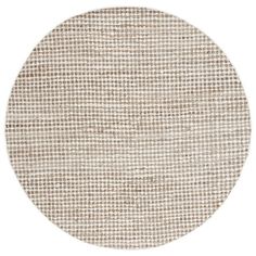 a round rug with brown and white checkered pattern on the bottom, in front of a