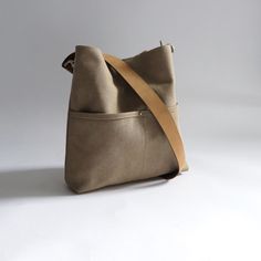 Urban-chic style crossbody bags that are neutral in color and effortlessly casual. When you need a mid-sized bag with easy access front pockets, just the right amount of not-too-slouchy shape and the perfect neutral shade, our updated take on the modern hobo bag is sized just right for everyday, on-the-go use. This listing is for the MEDIUM size bag in Khaki canvas. Urban Chic Fashion, Waxed Canvas, Urban Chic, Medium Size, Hobo Bag, Bucket Bag, Cotton Canvas, Leather Straps, Chic Style