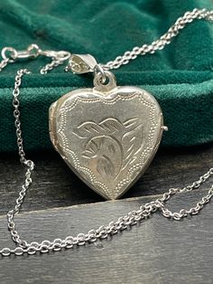 Vintage  silver locket for women. Double sided silver locket with hand engraved back and front.  Silver heart locket. Silver pendant . Silver necklace for women.       Vintage circa 50s. Mark: 925  Condition: necklace in perfect vintage condition. Materials: 925 Sterling Silver. Rhodium plated 925 silver chain.  Measure: chain 18"/ 45cm,   Locket  0.75" x 0.75"/  1.9 x 1.9 cm. Package: gift wrap available, please specify when ordering. Delivery: your order will be send by Royal Mail with trackin Silver Heart Locket, Silver Necklace For Women, Silver Locket, Gift For Her Birthday, Silver Lockets, Heart Locket, Pendant Silver, Women Vintage, Hand Engraving