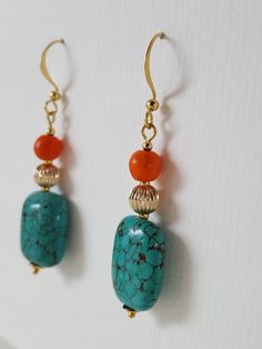 Stunning contrast of colours, textures, and materials - these earrings will complete your wonderful outfit. Turquoise, sitting next to a gold-filled corrugated beauty, sitting next to an orange howlite stone - Its a bold, blissful mix. Gold-filled bead Howlite stone Gold-plated ear wire Total length 5.5cm Drop length 4cm Comes with gift box. Orange Natural Stones Drop Earrings, Orange Natural Stone Drop Earrings, Handmade Vibrant Gold Earrings, Vibrant Handmade Gold Earrings, Bohemian Orange Earrings With Natural Stones, Orange And Gold, Howlite Stone, Stone Gold, Square Earrings