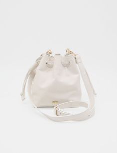 Introducing our elegant small Authenticity purse, crafted from genuine leather that exudes sophistication and timeless style. The detachable and adjustable cross body shoulder strap ensures versatile carrying options for any occasion. This bucket bag, with its two pull double cord drawstrings, is the perfect blend of luxury and practicality. ETHICALLY HANDCRAFTED BY STIVALI MEASUREMENTS: Length: 7" Width: 5" Height: 8" FEATURES/MATERIALS: Smooth leather Detachable & Adjustable cross body shoulde Card Bag, Womens Purses, Shoulder Purse, Yorkie, Timeless Style, Platform Sandals, Smooth Leather, Cross Body Handbags, White Leather