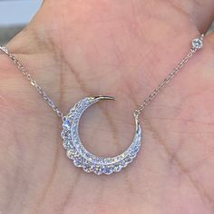 Stunning Diamond Moon Necklace.  Excellent craftsmanship and details.  The diamonds are very sparkling.  You have to see in person.  Lays perfectly on the neck.  The cable link chain is strong and comes with adjustable loops on the chain to be able to wear at 18", 17" or 16" lengths.  The moon is just slightly bigger than a nickel. About 22.1mm.    YELLOW GOLD SOLD OUT.  Genuine natural round brilliant cut diamonds total weight: 1.05 Carats Clarity: SI Color: F All very sparkling diamonds, no cl Elegant Moon-shaped Diamond Necklace Gift, Luxury White Gold Crescent Necklace, Luxury Crescent White Gold Necklace, Elegant Diamond Necklace With Moon Phase Detail, Elegant Diamond Necklace With Moon Phase, Elegant Diamond Moon Phase Jewelry, Elegant Moon-shaped Diamond Necklace, Elegant Moon Shaped Diamond Necklace, Luxury Moon Shaped Necklace