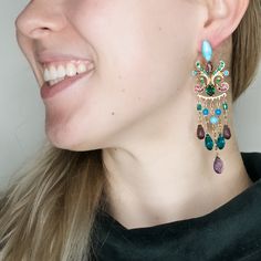 These earrings are from the designer's "Goddess Kali" Collection. Royal and elegant, the soft colors of the turquoise and the glow of the amethyst create an unexpected combination of strength and softness, delicacy and sturdiness. This piece is a perfect fit for a festive occasion (wedding!) or add them for a bit of dramatic sparkle to your favorite jeans! 3.5"L, 1"W 24K gold plated, Pierced Post backs Handmade in Tel Aviv, Israel More about AMARO and Where We Discovered Her: I love having my br Goddess Kali, Jewelry Gift Guide, Winter Jewelry, Artisan Earrings, Unique Holiday Gifts, The Glow, Community Board, Chandelier Earrings, Soft Colors