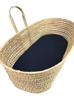 a large woven basket with blue lining on the bottom and handle is shown against a white background