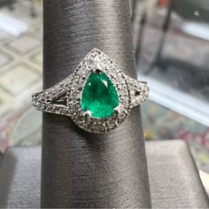 14k White Gold Diamond & Emerald Ring. 0.75 Carats. 4.2 Grams. Size 6. Pt1986 White Gold Emerald Ring With Center Stone, Formal White Gold Emerald Ring, Emerald Ring In 14k White Gold With Brilliant Cut, Exquisite White Gold Emerald Ring With Vvs Clarity, Gia Certified White Gold Cluster Jewelry, Green Classic Jewelry In 14k White Gold, Silver Emerald Ring With Brilliant Pear Cut, Gia Certified Cluster White Gold Jewelry, Gia Certified Platinum Jewelry For May Birthstone