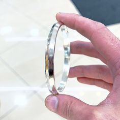 Hi Guys, this is a beautiful V Shape Bangle. It is made from pure 999 silver and weighs approximately 50-60 grams depending on the size you give me.  The width of the bangle is approximately 8mm.  Please message me your size before buying.  Please make sure the size you give me is correct because I will not be able to give a refund if you give me the wrong size, as I make this from scratch and by hand.  The bangle will also be stamped with a 999 stamp.  Any questions please ask :) Sterling Silver Bangle With Shiny Finish For Anniversary, Gift Polished Sterling Silver Bangle Bracelet, Silver Sterling Silver Bracelet With Shiny Finish, Silver Sterling Silver Bracelets With Shiny Finish, Sterling Silver Bracelets With Shiny Finish, Silver Sterling Bangle With Shiny Finish, Silver Sterling Silver Bangle With Shiny Finish, Silver Bangle With Shiny Finish, Silver Bangle With Shiny Finish For Wedding