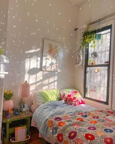 a bedroom with a bed and window covered in bubbles