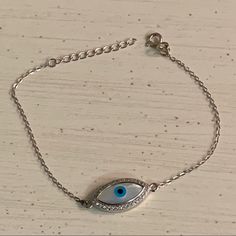 .925, Evil Eye & Mother Of Pearl With Cz Bracelet Evil Eye Sterling Silver Mother Of Pearl Cz Stones Adjustable Length Bracelet Picture #7 Is With The Flash On To Show The Shine Of The Cz This Evil Eye Bracelet Can Be Adjusted From 6.5” To 7.5” Wrists With The Additional Links On The Wrist Length Of The Bracelet Chain Believed That Evil Eye Absorb Bad Energy And Carry Magical Powers To Protect You Or Bring You Luck. Brand New Never Worn Nwot Please See Pictures Bracelet Picture, Silver Pandora Charms, Sparkly Bracelets, Bad Energy, Magical Powers, Gold And Silver Bracelets, Rose Gold Bangle, Cz Bracelet, Heavy Chain