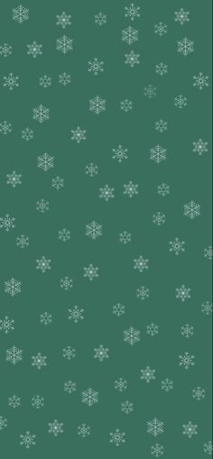 a green background with white snowflakes on it