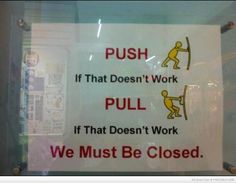 a sign that is on the side of a glass door