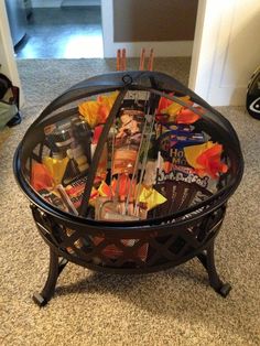 a coffee table made out of magazines and other items sitting on top of a carpeted floor