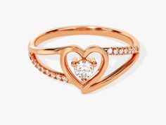 Make a statement with this classic Split Shank Diamond Heart Ring. Crafted with 0.18 ct of diamonds and set in 14K solid gold, this piece of jewelry makes a beautiful and romantic gift. Enjoy the timeless design and dazzle your loved one with its elegant sparkle. DETAILS: --Size Range: 2 US - 11 US--Weight (in 14k Gold): ~ 1.74 grams for Size 6.5 (Depends on the size)--Gold Kt Options: 14k and 18k--Color Options: Yellow Gold, Rose Gold and White Gold--Gemstone: Diamond--Diamond Cut: Round--Numbe Anniversary Diamond Ring Open Heart Style, Fine Jewelry Anniversary Diamond Ring With Open Heart, Anniversary Open Heart Diamond Ring, Promise Heart Ring In Rose Gold With Brilliant Cut, Rose Gold Heart Ring With Brilliant Cut For Promise, Rose Gold Brilliant Cut Heart Promise Ring, Rose Gold Cubic Zirconia Heart Ring For Promise, Luxury Rose Gold Heart Ring For Valentine's Day, Elegant 14k Gold Heart Ring In Diamond White