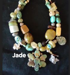 "Jade" Jaw dropping wow factor... one of a kind turquoise necklace! The unique pendant is highlighted by a combination of turquoise stones in a variety of shapes and  colors, tumbled stone, tiger eye and glass has been beaded in. A old African trading bead adds some interest. A couple of fun dangles add some eye candy. Go ahead... be unique.. wear art and rock your look! Measures 17 inches from end to end. Hook closure. Your jewelry should always make you smile.. Item # 337 Handmade Artistic Jewelry With Round Beads, Artistic Handmade Jewelry With Round Beads, Artistic Handmade Round Bead Jewelry, Handmade Unique Double Strand Beaded Necklaces, Unique Handmade Double Strand Beaded Necklaces, Handmade Artisan Double Strand Beaded Necklace, Artisan Green Jewelry With Unique Variations, Handmade Turquoise Beaded Necklaces, Unique Handmade Turquoise Beaded Necklaces