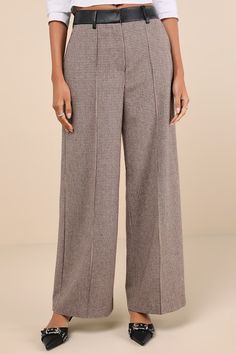 Your style will attract compliments all season long in the Lulus Memorably Chic Brown Houndstooth Tweed Wide-Leg Pants! Midweight woven fabric, with a wool-like feel and a houndstooth design throughout, falls from a faux leather waistband with matching belt loops. Hidden zip fly (with top clasp closures) secures at the front, atop wide legs with front diagonal pockets and pintuck-style detailing. Ankle-length hems complete the look. Decorative welt pockets at back. Fit: This garment fits true to Chic Wool Bottoms For Fall, Chic Tweed Pants For Workwear, Tailored Tweed Bottoms For Fall, Tailored Tweed Fall Bottoms, Tweed Bottoms For Workwear In Fall, Wool Bottoms For Office In Fall, Chic Plaid Wide Leg Pants, Fall Tweed Bottoms For Work, Tailored Houndstooth Bottoms For Fall