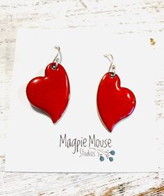 Heart Earrings ~ Red Enamel Minimalist Asymmetrical Heart Drop Earrings by MagpieMouseStudios on Etsy https://www.etsy.com/listing/750341562/heart-earrings-red-enamel-minimalist Heart Charm Enamel Earrings, Heart-shaped Enamel Earrings With Charm, Valentine's Day Heart Charm Enamel Earrings, Handmade Heart-shaped Enamel Earrings, Red Teardrop Earrings For Valentine's Day, Valentine's Day Enamel Dangle Earrings, Enamel Heart Charm Earrings As Gift, Enamel Earrings With Heart Charm As Gift, Red Nickel-free Dangle Heart Earrings