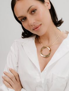 - Two chains in one: starts layering for you - Immersed in 18k gold - Bold naturally ridged pendant - Naturally shaped to ground you Gold Plated Medallion Necklace With Round Pendant, Gold Plated Clavicle Chain Jewelry, Formal Gold Plated Snake Chain Jewelry, 14k Gold Chain Jewelry, Gold Plated Snake Chain Jewelry For Formal Occasions, Gold Round Medallion Necklace, Gold Necklace With Round Pendant Chain, Gold-tone Round Chain Necklace For Formal Events, Yellow Gold Necklace With Round Pendant